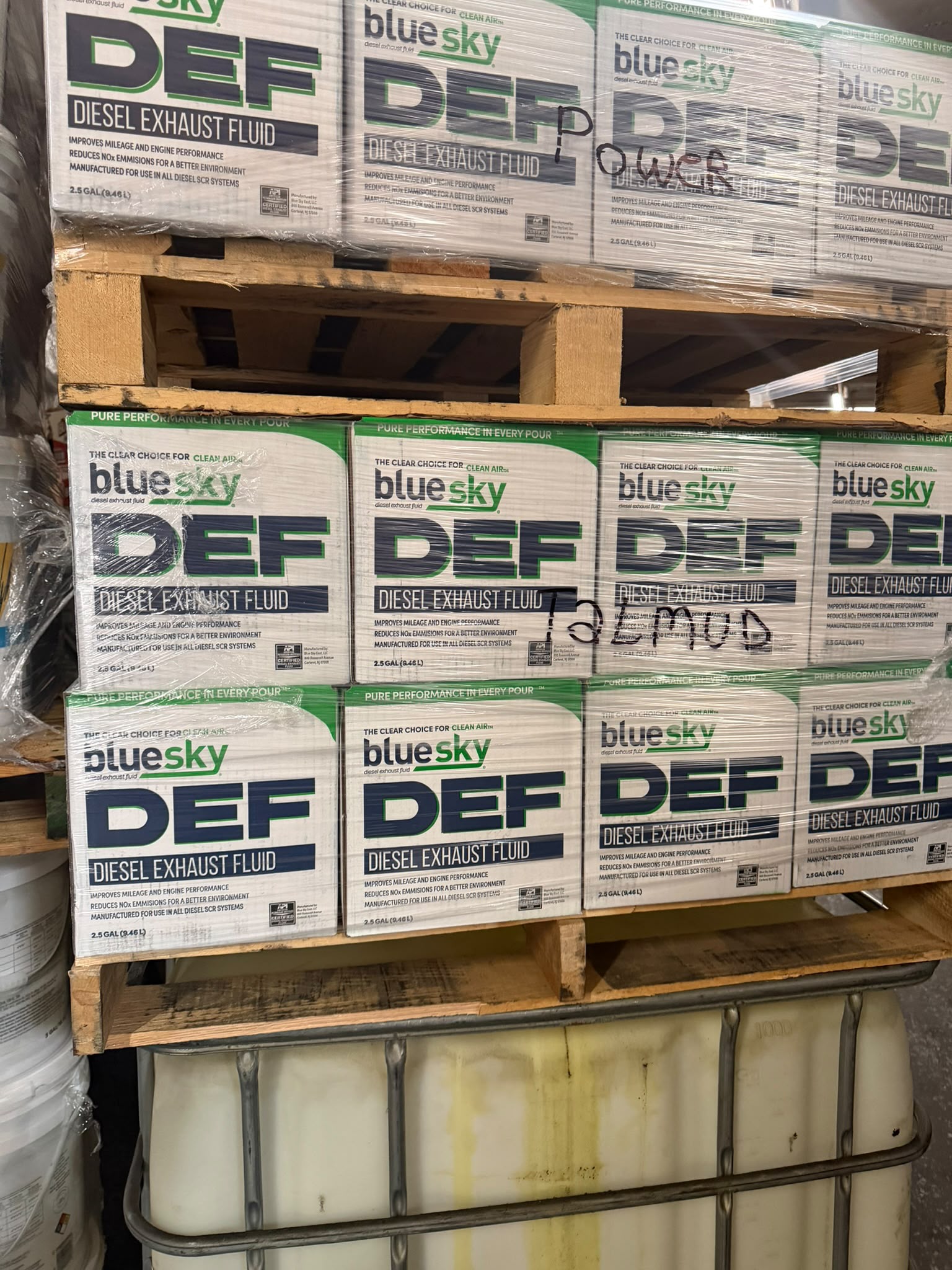 Stacked cases of Blue Sky DEF diesel exhaust fluid
