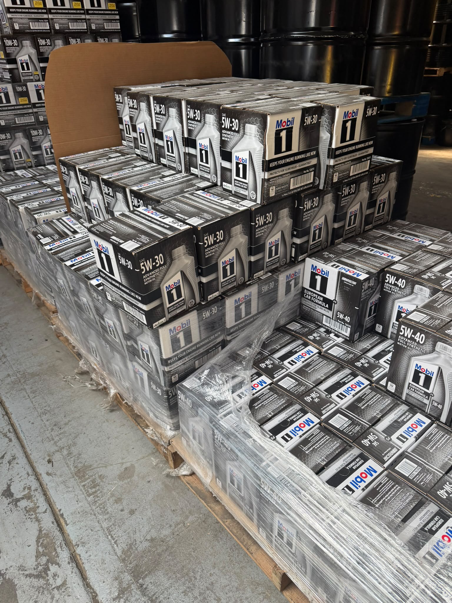 Cases of Mobil 1 motor oil stacked in the Bass Oil warehouse