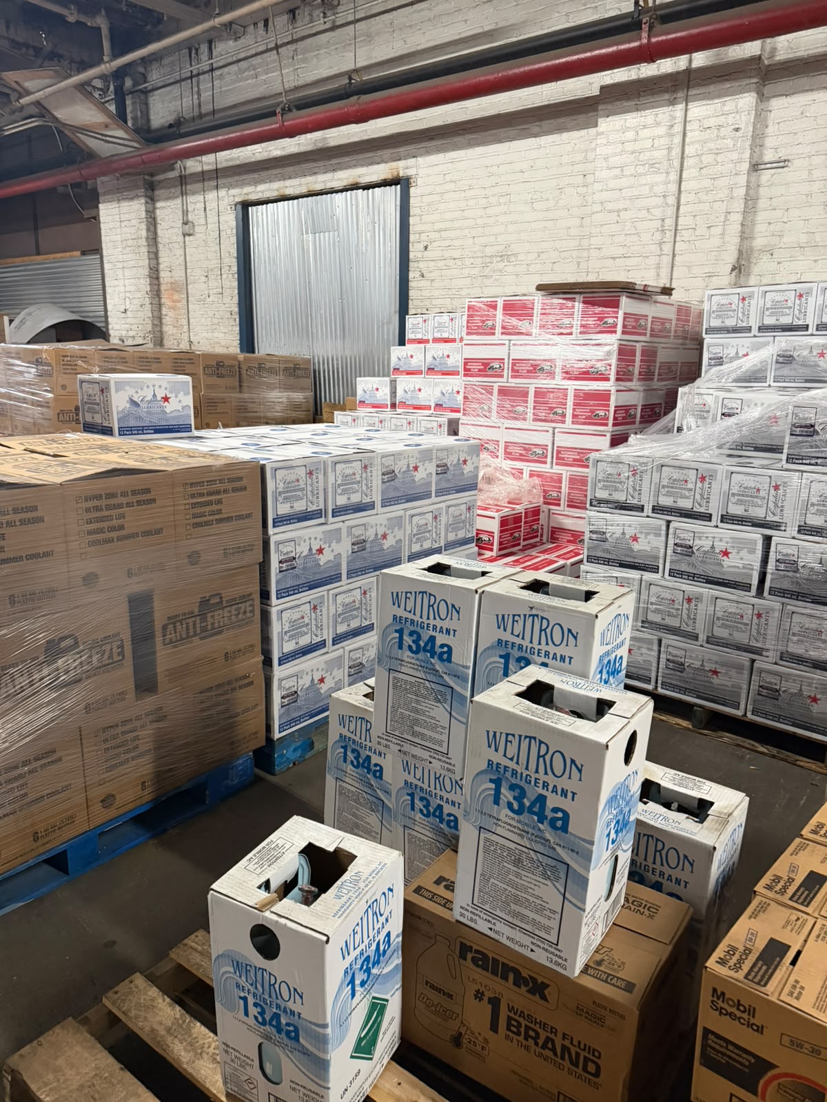 Cases of Weitron 134a refrigerant with Rain-X washer fluid and Mobil Special in the Bass Oil warehouse