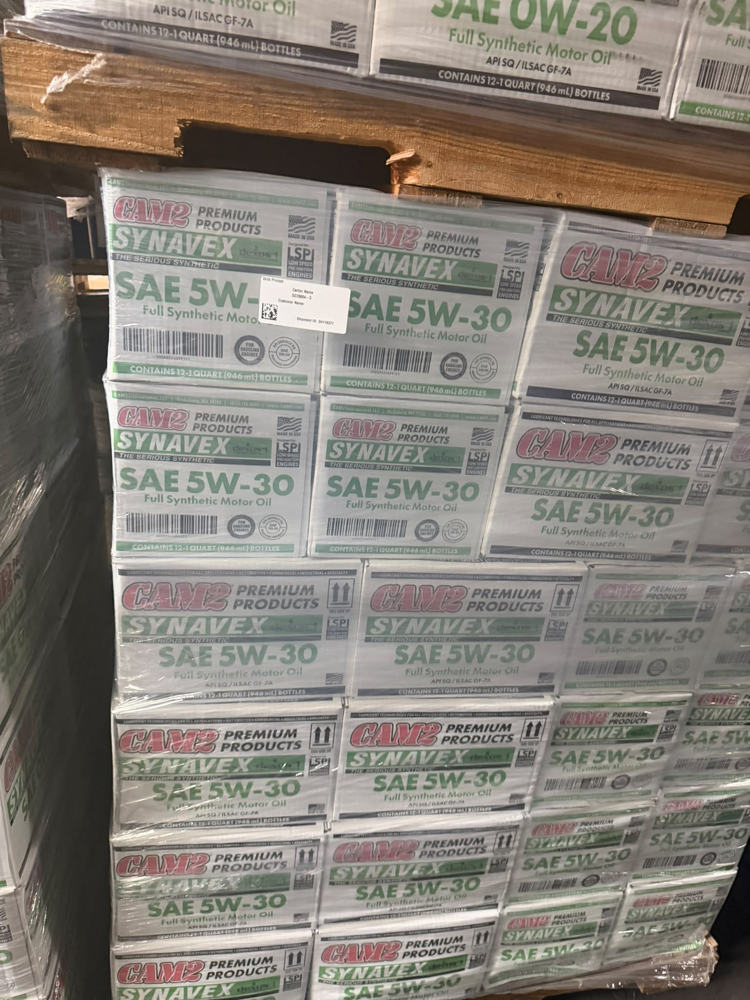 Tall pallet stack of CAM2 Synavex dexos1 SAE 5W-30 Full Synthetic Motor Oil cases at the Bass Oil warehouse in Brooklyn