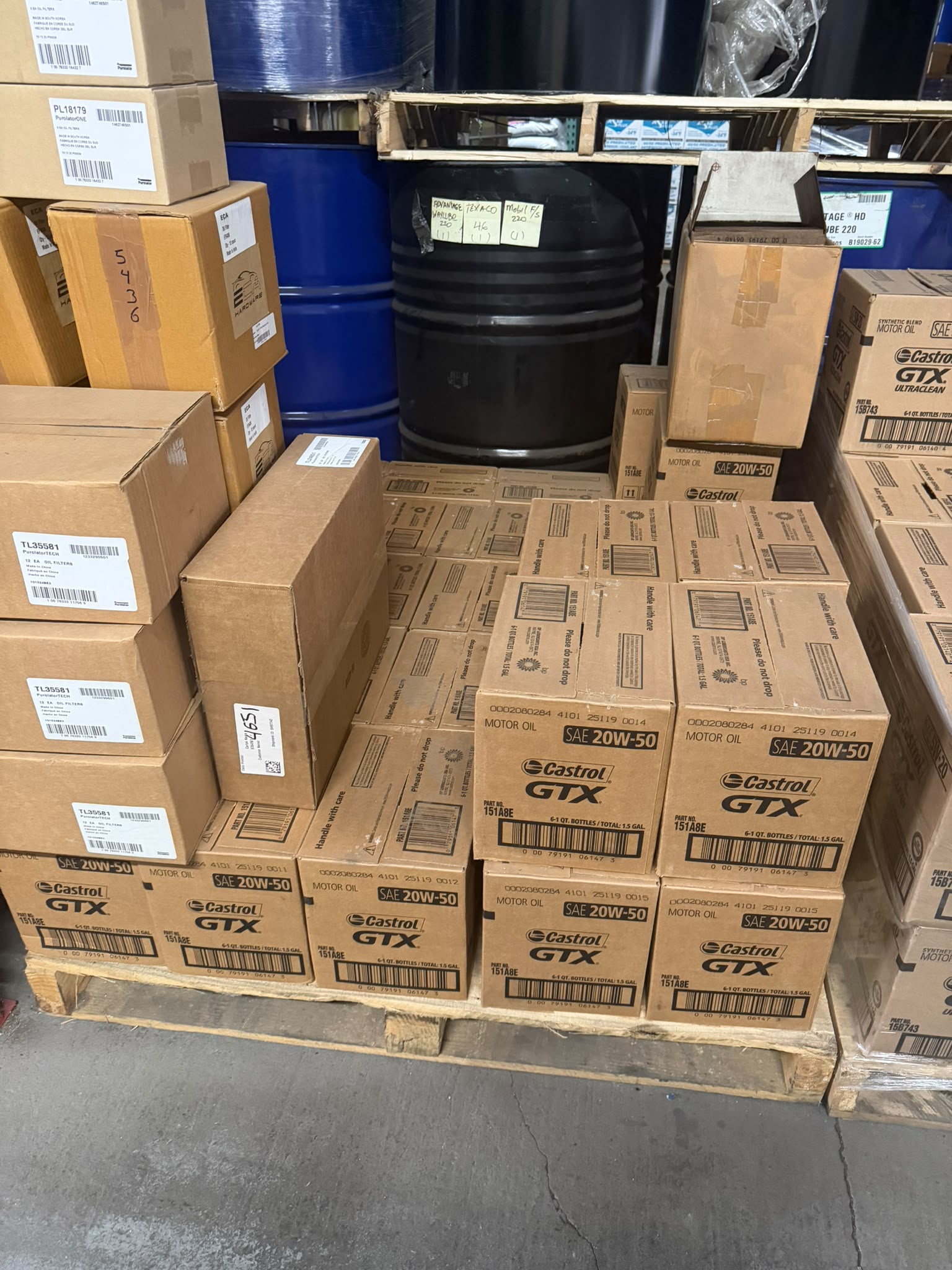 Cases of Castrol GTX SAE 20W-50 motor oil on a pallet at the Bass Oil warehouse in Brooklyn