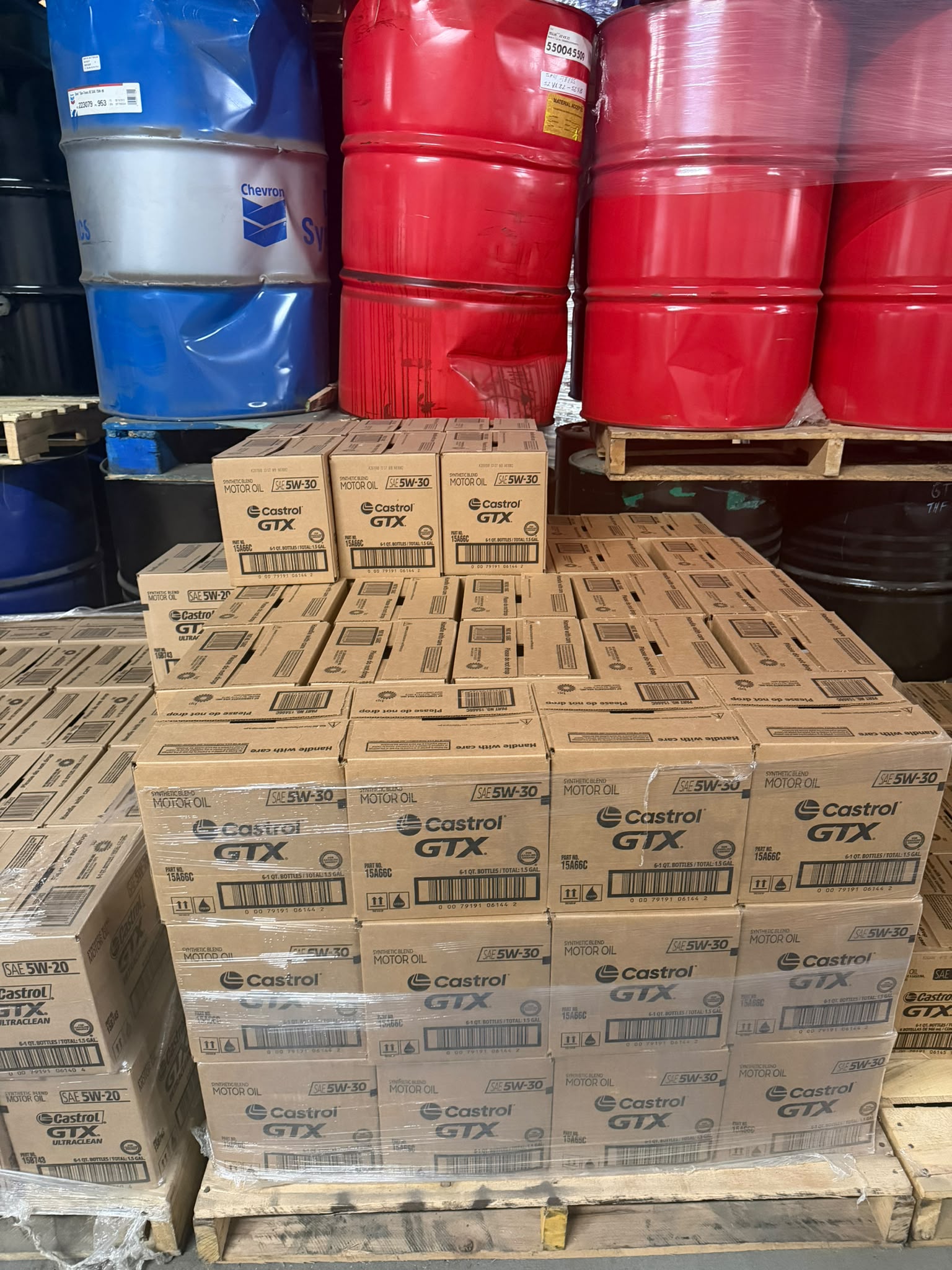 Cases of Castrol GTX SAE 5W-30 synthetic blend motor oil on a pallet at the Bass Oil warehouse in Brooklyn