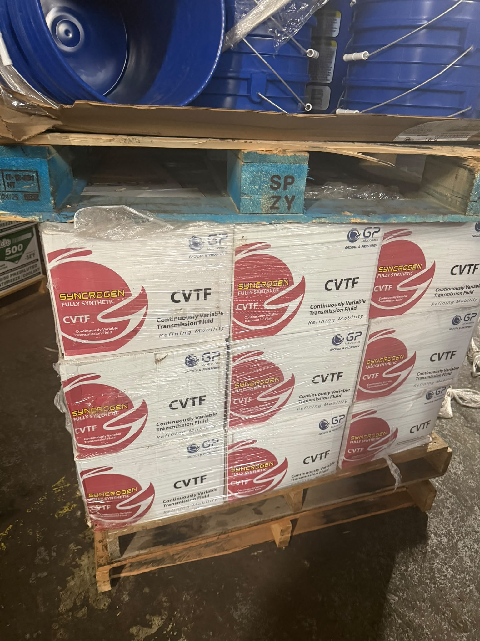 Cases of GP Syncrogen Fully Synthetic CVTF continuously variable transmission fluid on a pallet at the Bass Oil warehouse in Brooklyn