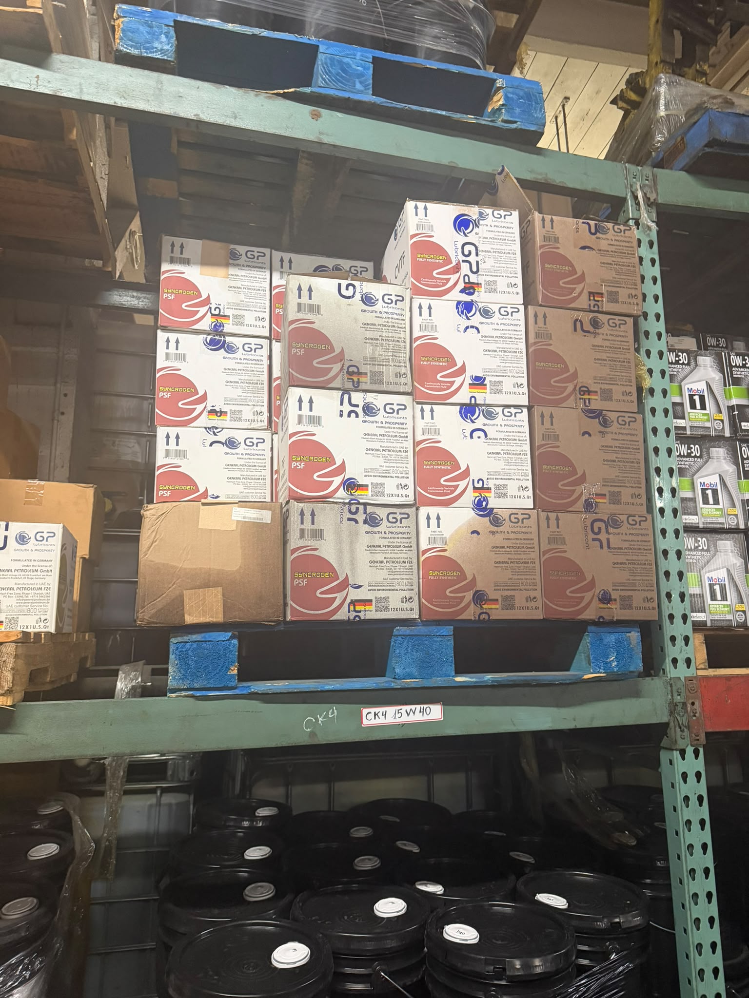 Cases of GP General Petroleum Syncrogen PSF Power Steering Fluid on the rack at the Bass Oil warehouse in Brooklyn