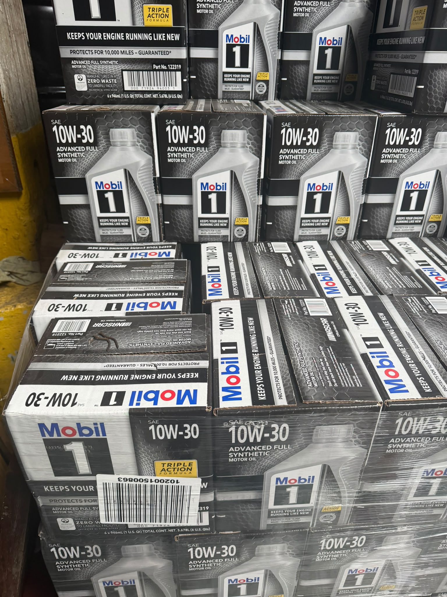Close-up of Mobil 1 SAE 10W-30 advanced full synthetic motor oil cases at the Bass Oil warehouse in Brooklyn