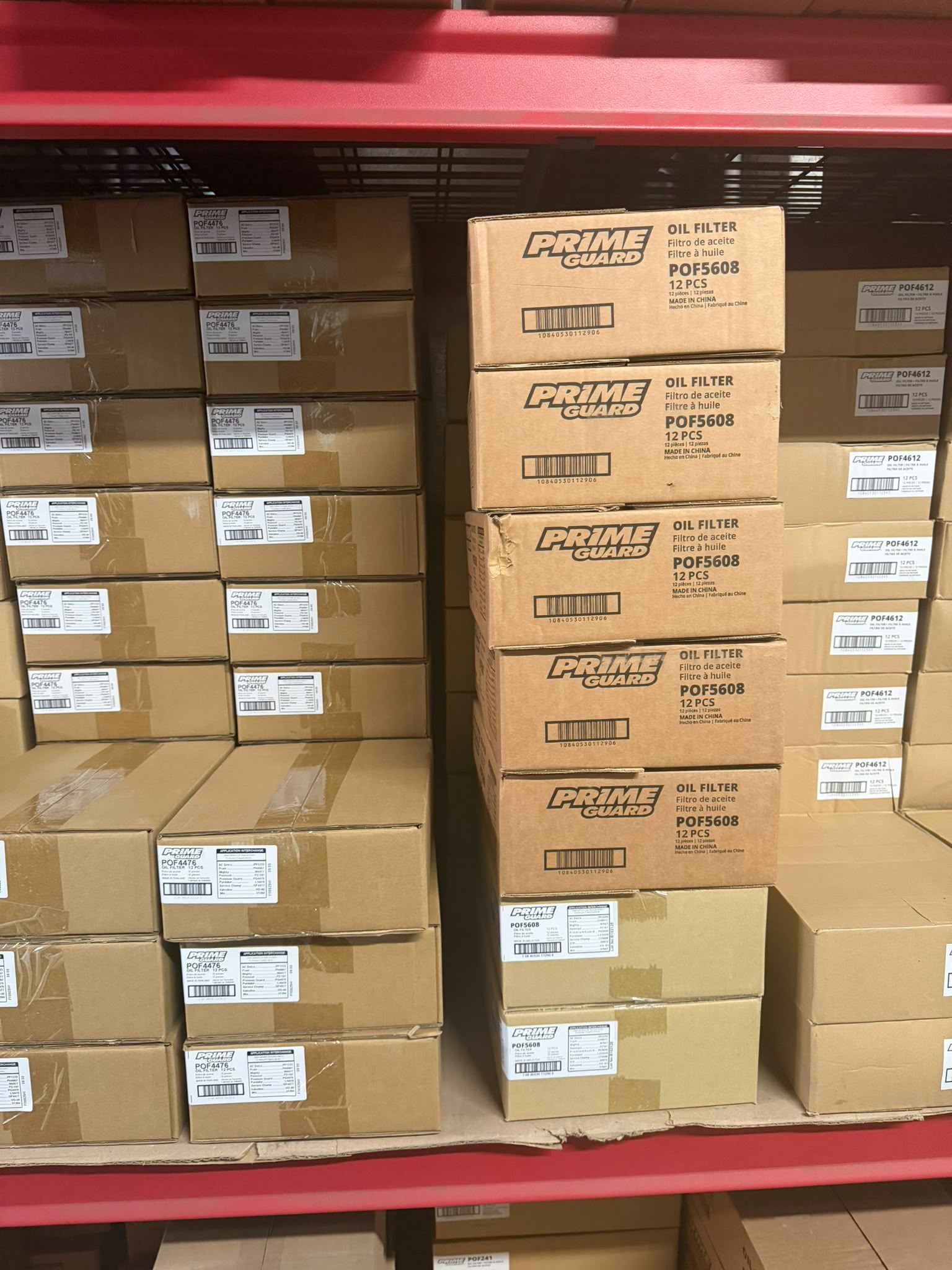 Cases of Prime Guard POF5608 oil filters on the shelf at the Bass Oil warehouse in Brooklyn