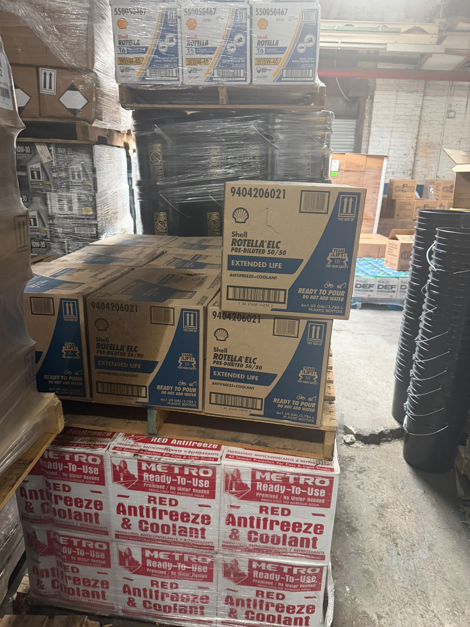 Shell Rotella ELC Pre-Diluted 50/50 Extended Life Antifreeze and Coolant cases stacked over METRO Ready-To-Use Red Antifreeze and Coolant at the Bass Oil warehouse in Brooklyn